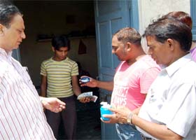 Officials collect samples of water