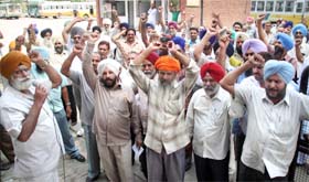 Punjab Roadways employees protest near the Jalandhar bus stand