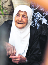 Zahiya Hamoushi, a villager, reacts after clashes between Lebanese and Israeli soldiers in southern Lebanon. 