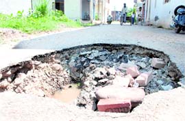 A potholed road at Babhat village in Zirakpur