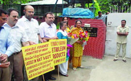 Members of the Delhi Petrol Dealers Association hold placards during a protest outside union finance minister Pranab Mukherjees residence in New Delhi on Wednesday. They are seeking value added tax on diesel on a par with Haryana and Punjab as lower price of diesel, particularly in Haryana, is taking its toll on Delhi petrol dealers.