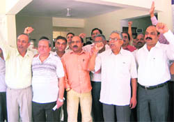 Tax advocates hold a protest in Dehradun on Wednesday.