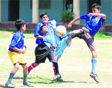 A match in progress at the SGRR Sahodaya Complex Sub-Junior Football Tournament in Dehradun on Wednesday. 