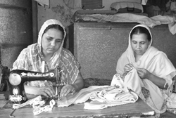 Sisters Kulvinder Kaur and Jasvinder Kaur sew clothes and sell cosmetics to make both ends meet