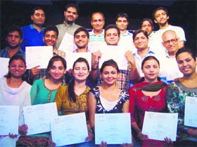 The artists of Natrang with their certificates at Natrang Studio Theatre, Jammu, on Wednesday.