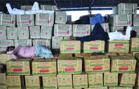 Labourers rest in Azadpur Mandi after wholesale traders of fruits and vegetables went on strike in New Delhi