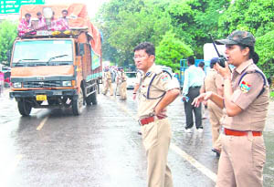 SSP Sanjay Gunjiyal and CO, Mussoorie, Shweta Chaubey guide Dak Kanwars in Haridwar on Thursday.