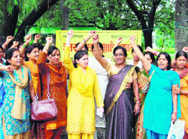 ASHA workers hold a protest in Dehradun on Thursday.