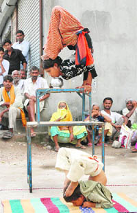 Six-year-old Bharat and his sister from Allahabad perform delicate acts to earn livelihood in Karnal.