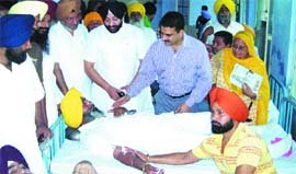 Dr Inderjit Kaur, President, All-India Pingalwara Charitable Society, Police Commissioner Varinder Kumar and MLA Inderbir Singh Bularia talk to blood donors at a camp in Amritsar.
