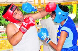Boxers slug it out during the inter-school meet at SD College, Sector 32, Chandigarh, on Friday.