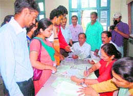 Candidates fill forms during counselling at B.Ed College, Dharamsala, on Friday.