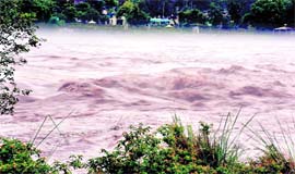 The Chenab flows above the danger mark in Akhnoor on Friday.