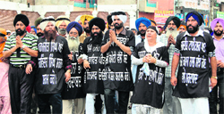 Members of the Danga Peerat Welfare Society hold a peace march in Amritsar 
