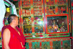 A priest shows the place from where the rare relics were stolen