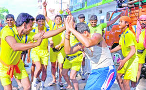 Kanwariyas dance to music at Kankhal in Haridwar on Saturday. As the Kanwar Yatra ends on Sunday, more than 80 lakh Kanwariyas are in the holy city to fetch water of the Ganga in order to offer it to Lord Shiva at temples near their homes.