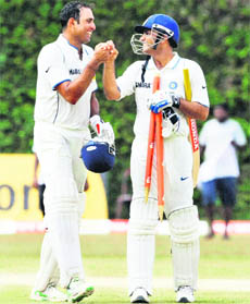 Man of the series Virender Sehwag (right) and man of the match VVS Laxman celebrate victory over Sri Lanka in the final Test in Colombo on Saturday.