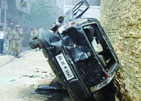 A car damaged in the violence at Gokulpuri in New Delhi