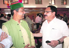 National BJP general secretary JP Nadda (R) and Mohinder Pande, national coordinator for frontal organisations of the party, during a function organised by the party in Shimla on Sunday. 