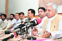 National Conference leader Ajay Sadhotra (extreme right) addresses mediapersons in Jammu on Sunday. 