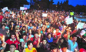 A candlelight vigil organised by the All Ladakh Students Association for the victims of Leh flash floods, in Jammu on Sunday. 