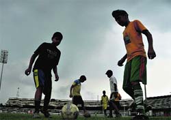 Soccer players train under an overcast sky in Ludhiana on Sunday
