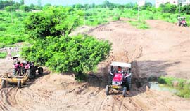 Work in progress to clear Jayanti Ki Rao rivulet of wild growth at Kharar