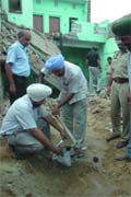 Officials of the forensic team collecting samples from the spot where the blast took place at Jogi Nagar on Saturday in Bathinda on Monday. 