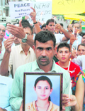 Members of the welfare association take out a candlelight march in Sector 38 (West)