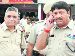 SHO of the Sector 39 police station Janak Rana and (right) DSP (South) Vijay Kumar listens phone.