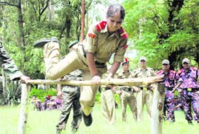 An NCC cadet jumps a hurdle during their training at a camp at Anarwala village near Dehradun