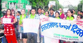 Members of the Citizens for Green Doon hold a protest in Dehradun on Monday.