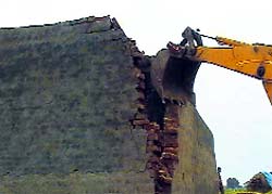 An illegal structure being demolished at Issharheri village in Jhajjar district.