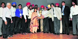 Agatha Sangma, Minister of State for Rural Development and Agriculture, presents e-India Citizens Choice Award to Dr Rajneesh Arora, vice-chancellor, PTU.