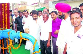 Haryana Minister Gopal Kanda inaugurates a tubewell in a Sirsa locality.