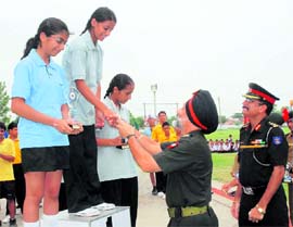 Major-Gen Deepinder Singh, Chief of Staff, 2 Corps, presents trophies to the winners as the principal of Sainik School, Kunjpura; Col Arun Datta, looks on at the concluding day of the first IPSE Sports climbing competition at Saink School, Kunjpura.