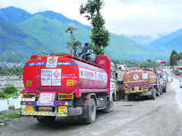 Oil tankers from the Leh region await reopening of the Manali-Leh highway near Bahang, about 4 km from Manali, on Monday.