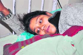Sakina Bano, an Assamese married to a Ladakh man, with her newborn baby girl at a hospital in Leh