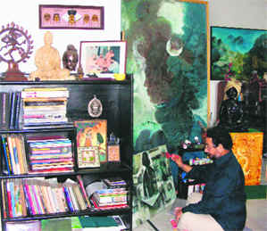 L-R: Ravinder Sharma gives the finishing touches to a painting, Surkhab Shaukin displays his photographs at his gallery in Sector 16