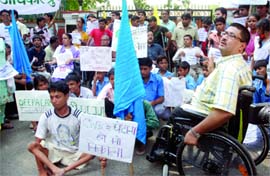 Javed Abidi, convenor of the Disabled Rights Group, with disabled athletes and activists protests outside Union sports minister M.S. Gill's residence in New Delhi on Tuesday.