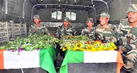 Army personnel with bodies of jawans recovered on Tuesday.