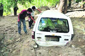 A car buried in slush in Saboo village