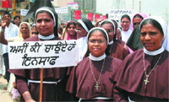 Members of Christian community take out a protest march in Jalandhar. 
