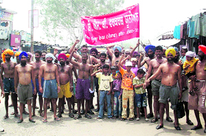 Daily-wage employees of the BBMB hold a protest in support of their demands at Nangal on Tuesday.