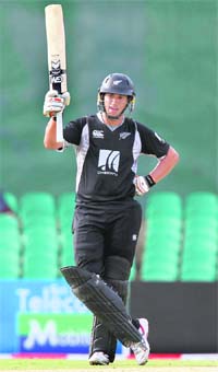 New Zealands captain Ross Taylor raises his bat after completing his half century against India in Dambulla