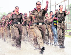 NCC cadets rehearse in the rain ahead of the Independence Day function at Parade Ground in Sector 17, Chandigarh, on Wednesday