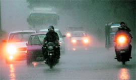 Darkness reigns: Vehicles manoeuvre in poor visibility after heavy rain in Chandigarh on Wednesday