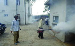 MCD officials carry out fogging at the Palam Village police station where 50 jawans were infected by dengue in New Delhi 