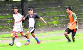 Players vie for the ball during a match in the Under-16 District-level Football Tournament at Pavilion Ground in Dehradun