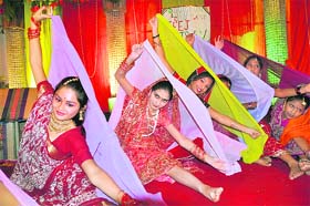Women perform at a Teej function in Dehradun